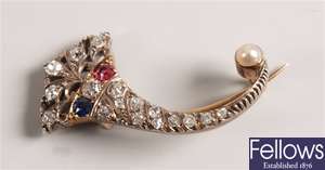 Ornate diamond, sapphire and ruby brooch of