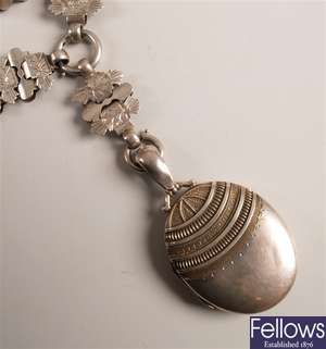 Victorian silver oval locket with a curved ribbed