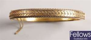 15ct gold hinged hollow bangle with a circular
