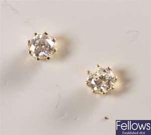 Pair of 18ct yellow gold claw set single stone