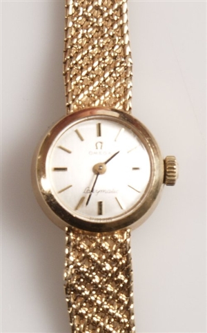 OMEGA - a ladies 9ct yellow gold round watch head