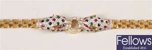Gold gate style bracelet with a diamond and gem