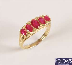 18ct gold graduated five stone ruby carved half