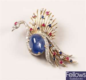 A multi gem set peacock brooch with a star