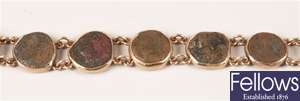 Gold mounted roman coin set bracelet. Weight -