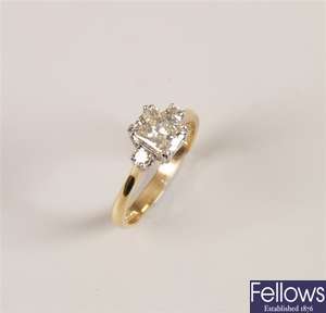 18ct gold three stone diamond ring with a central