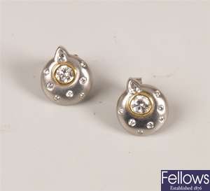 Pair of platinum and diamond stud earrings with a