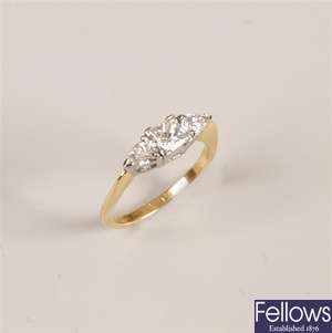 18ct gold three stone diamond ring, with a