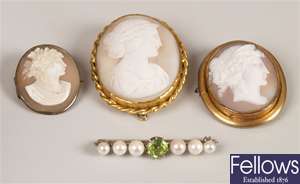 Four brooches to include a peridot and cultured