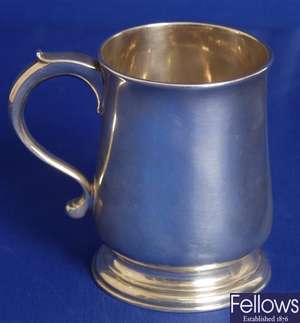 George II tankard with scrolled handle and
