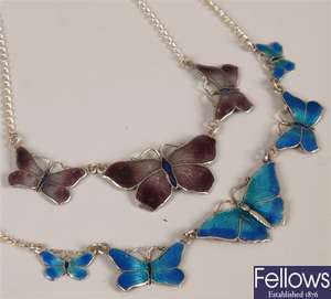 Two silver enamelled butterfly design necklaces.