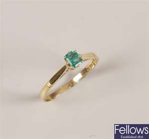 18ct gold single stone emerald ring set a step