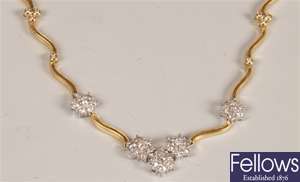 18ct gold floral design diamond set necklet, with