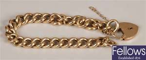 Curb link bracelet with padlock and safety chain,