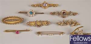 A collection of nine brooches to include a 15ct