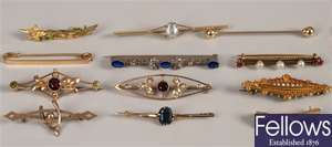 A collection of twelve brooches to include a 15