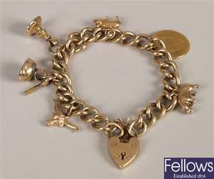 9ct gold curb link charm bracelet with padlock