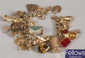 9ct gold curb link bracelet with twenty three