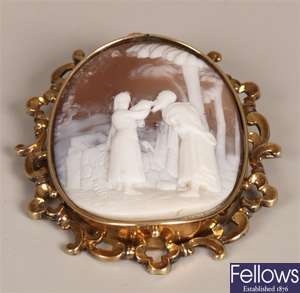 Oval shell cameo brooch depicting a male and