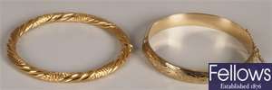 Two 9ct gold bangles, to include a hinged bangle
