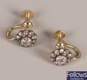 Diamond cluster stud earrings with a central old