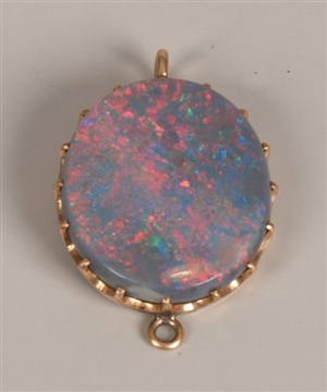 An oval black opal (measuring 1.9 by 1.6cms) -