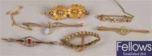 Six brooches, to include a 9ct gold opal and seed