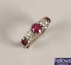 Five stone graduated ruby and diamond ring with