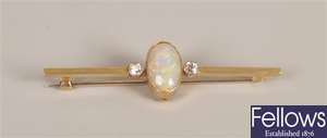 Three stone opal and diamond set bar brooch,  a
