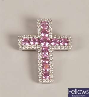 Pink sapphire and diamond cross with a central