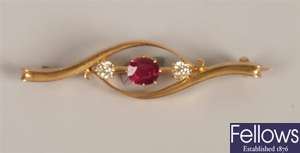 Three stone ruby and diamond set bar brooch, with