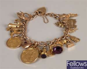 9ct gold curb link charm bracelet with padlock