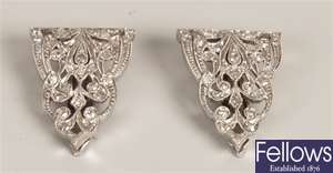 A pair of diamond clip brooches of triangular