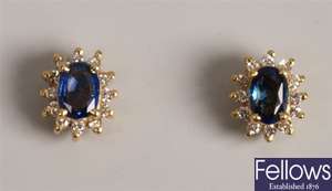Pair of oval sapphire and diamond cluster