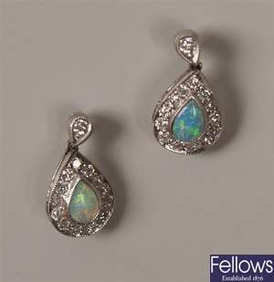 A pair of 18ct white gold opal and diamond set