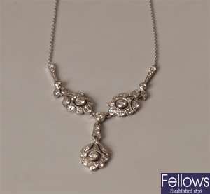 18ct white gold ornate diamond set necklet, a