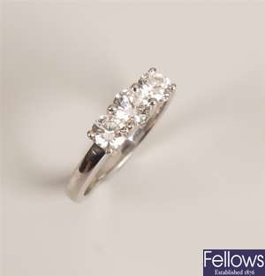 Platinum mounted three stone diamond ring - the