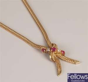 Ruby and diamond set cross over design necklace