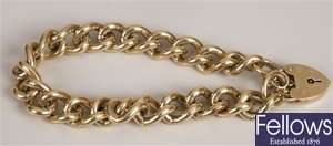 9ct yellow gold curb bracelet and padlock. 