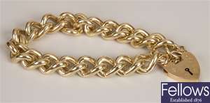 9ct gold solid curb link bracelet and padlock. 
