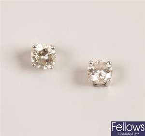 Pair of 18ct gold claw set diamond stud earrings