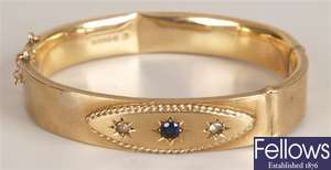 9ct gold three stone sapphire and paste bangle