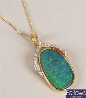 18 carat gold boulder opal and diamond pendant