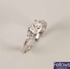 18k white gold three stone diamond ring with a