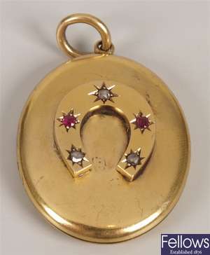 Oval ruby and diamonds point set horseshoe design