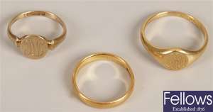 Three rings, to include a 22ct gold band ring, an