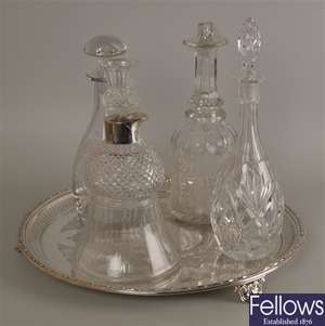 Four cut glass decanters, each with stoppers, one