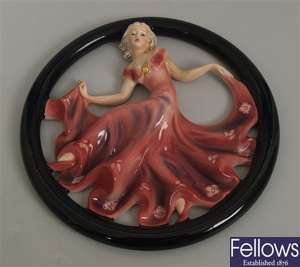 A Goebel circular pottery wall plaque modelled as