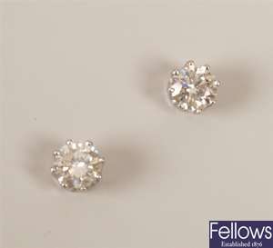 Pair of single stone diamond stud earrings set a
