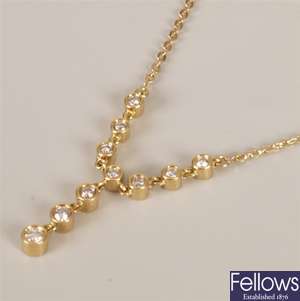 18ct gold diamond necklet with a central round